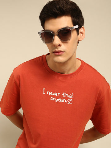 Never Finish Anything: Rust typography print oversized fit tshirt