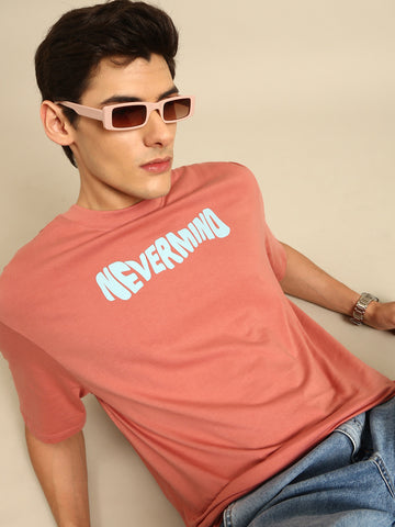 Nevermind: Pink typography print oversized fit tshirt