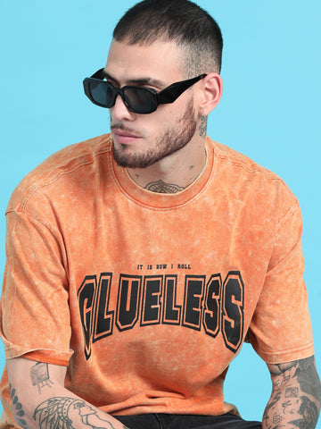 Clueless: Orange Typography Print Acid Wash Oversized Tshirt